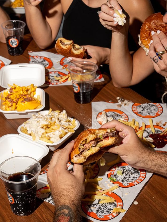 Smasheat burgers and loaded fries on the table